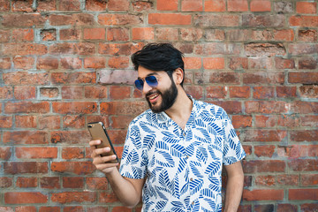 Young man using his mobile phone.