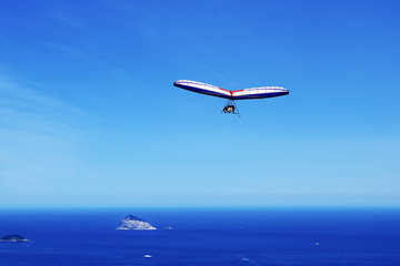 Fototapeta na wymiar Hang-glider flying over Ilhas Cagarras, Rio de Janeiro