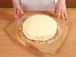Filling cake layers. Making Chocolate Layer Cake with Cream Cheese Filling and Chocolate Topping. Series.