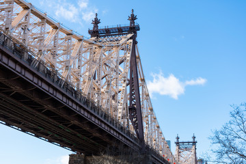 Looking Up at the Queensboro Bridge and a Blue Sky in New York City