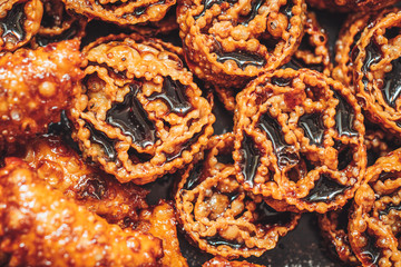 Cartellate, a delicious traditional pastry from Puglia, filled with fig syrup