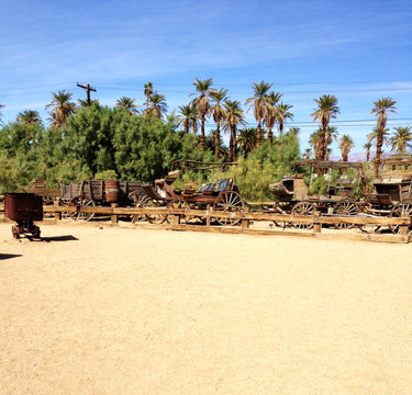 Post and horse-drawn carriages at a borax mine in Death Valley