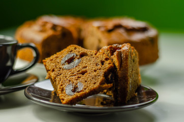 Sliced delicious spiced fruit cake served on a ceramic plate