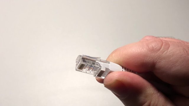 rj45 connection ethernet cable hand