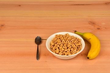 Oats cereal  in bowl with banana.