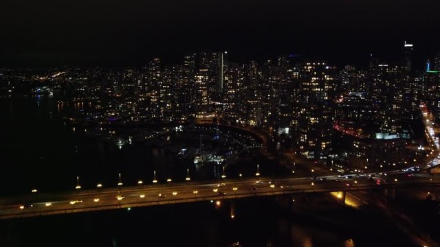 Night fly over the bridge towards Vancouver downtown