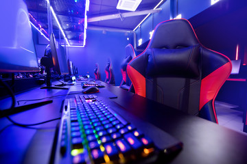 Professional gamers cafe room with powerful personal computer game chair blue color. Concept cyber sport arena