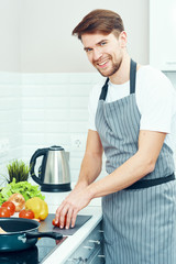 young man cooking in the kitchen