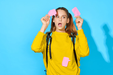 girl with backpack and poles