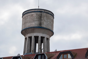 Water tower close-up. It is used where water pressure is not sufficient. Made of concrete.