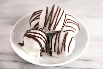 A Pile of White Chocolate Covered Chocolate Sandwich Cookie Truffles