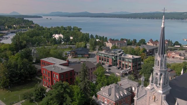 Aeria flying over the town of Magog in the eastern townships. In the distance is Lake Memphremagog. Quebec, Canada
