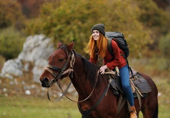Foto op Canvas young woman riding horse © SHOTPRIME STUDIO
