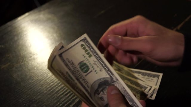 
Counting money in a dark room 