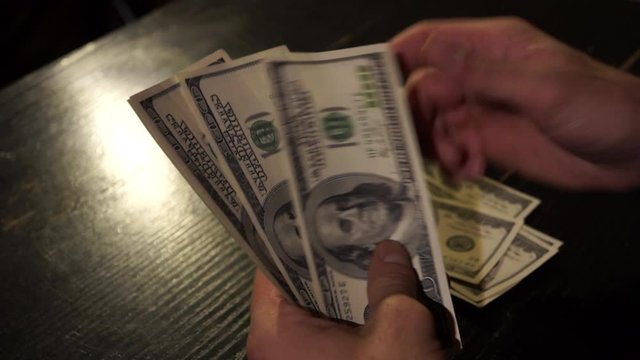 
Counting money in a dark room 