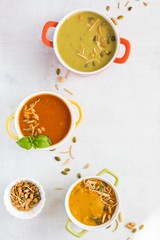 Bowls of soup and garnish.