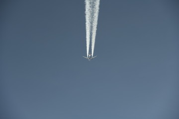aerial view of a jet creating a contrail