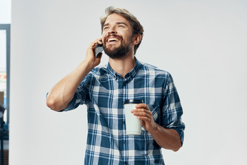 young man talking on the phone isolated on white
