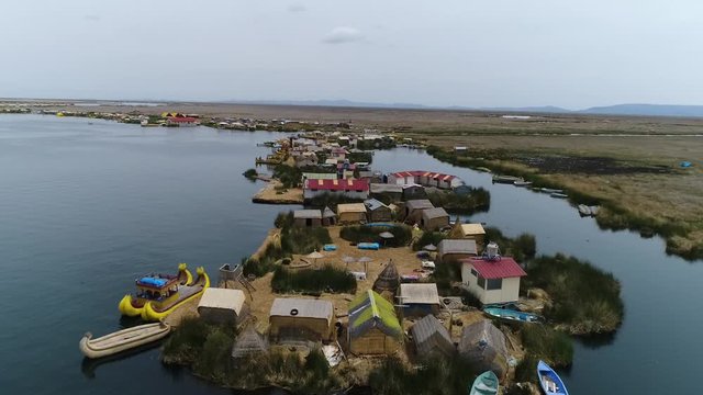 Slow drone movement. Uros Floating Islands over Titicaca lake, Peru