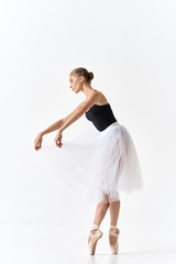 young ballet dancer posing on white background