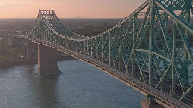 Aerial flying over traffic on the  the Jacques Cartier Bridge. Montreal, Quebec, Canada.