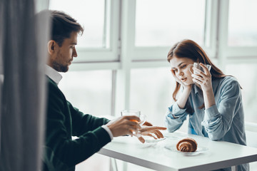man and woman talking on the phone