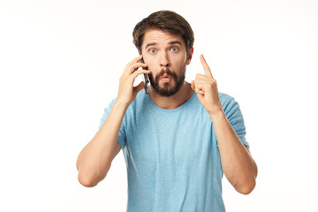 young man talking on the phone isolated on white