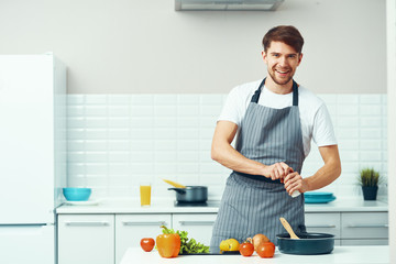 man preparing food in the kitchen
