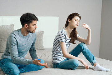 young couple sitting on couch