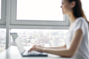 businesswoman working on laptop in an office