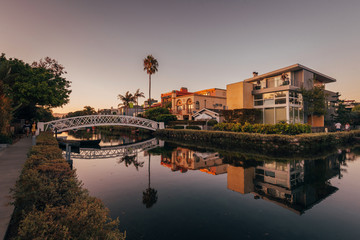 Canal and houses at sunset, in Venice Beach, Los Angeles, California © jonbilous
