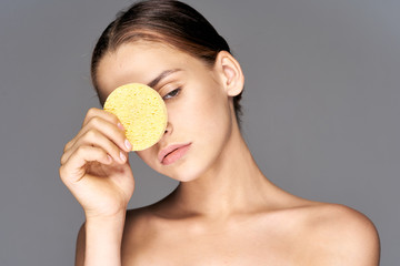 portrait of young woman with cucumber