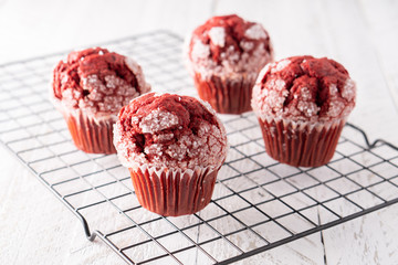 Red velvet muffin cupcake on cooling rack