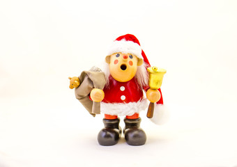 A wooden Santa figurine isolated on a white background image for background use with copy space in horizontal format