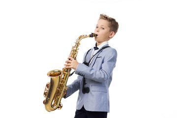 Fototapeta premium Boy musician plays the saxophone