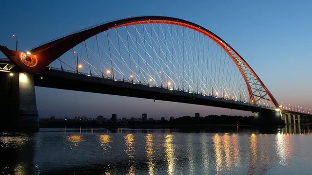 Night video of cable-stayed bridge Bugrinskiy over river Ob in Novosibirsk, Siberia, Russia