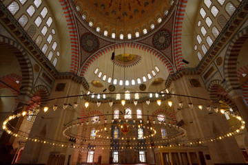 Fototapeta na wymiar Interior of Suleymaniye Mosque with Qiblah wall chandelier and ceiling dome Istanbul Turkey