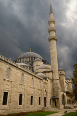 Fototapeta na wymiar Front facade of Suleymaniye Mosque with storm clouds Istanbul Turkey