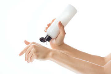 hand with bottle of perfume isolated on white