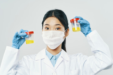 chemist with tubes and chemicals in test tubes