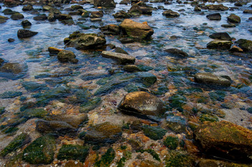 Beautiful seaside boulders and bright sea water