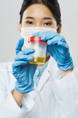 Fototapeta premium scientist in laboratory with test tubes
