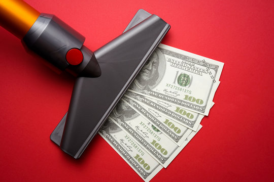 Vacuum Cleaner Nozzle Sucking Money Dollar Bill On Red Background