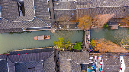 Aerial view Zhujiajiao Water Town and China traditional tourist boats on canals of Shanghai Zhujiajiao Water Town in Shanghai, China.