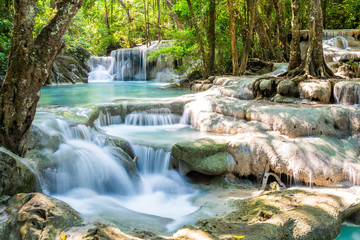 Waterfall and blue emerald water color in Erawan national park. Erawan Waterfall, Beautiful nature rock waterfall steps in tropical rainforest at Kanchanaburi province, Thailand