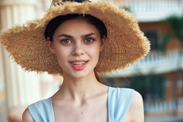 portrait of young woman in straw hat