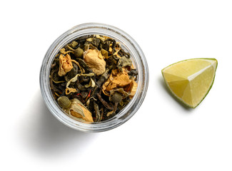 Green tea with natural aromatic additives. Top view on white background