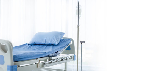 Clean adjustable patient's bed in hospital room. Clean adjustable bed is for patient who admitted to hospital for medical treatment and rehabilitation. Health insurance coverage & P.A. care concept. 