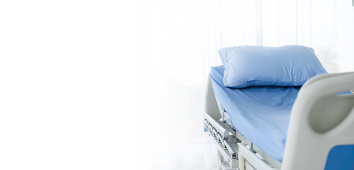 Clean adjustable patient's bed in hospital room. Clean adjustable bed is for patient who admitted to hospital for medical treatment and rehabilitation. Health insurance coverage & P.A. care concept. 