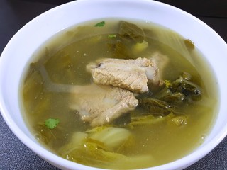 Thai food style, Top view of pork meat soup with vegetables in white bowl as a background, healthy food concept, Ready to eat